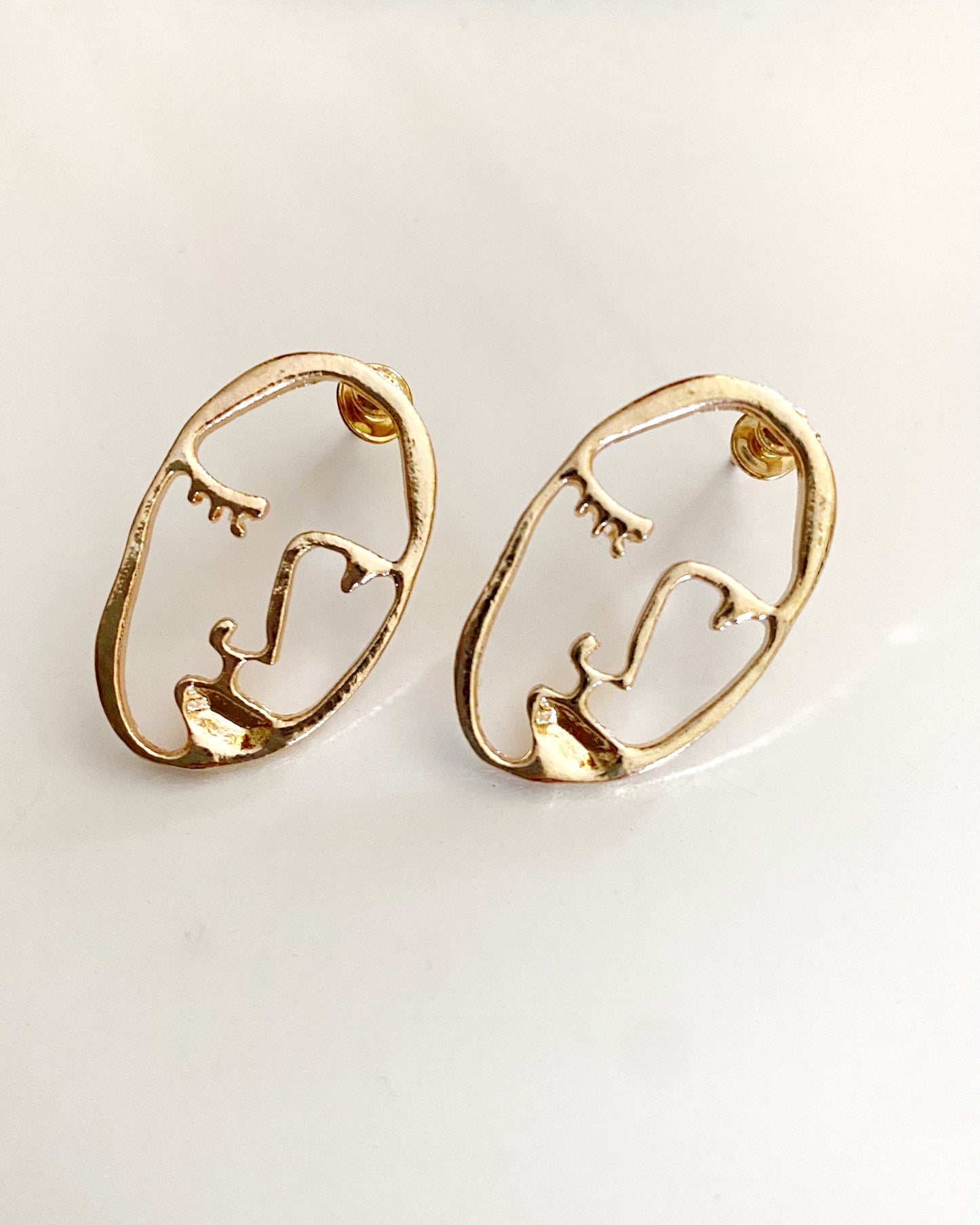 GOLD FACE EARRINGS